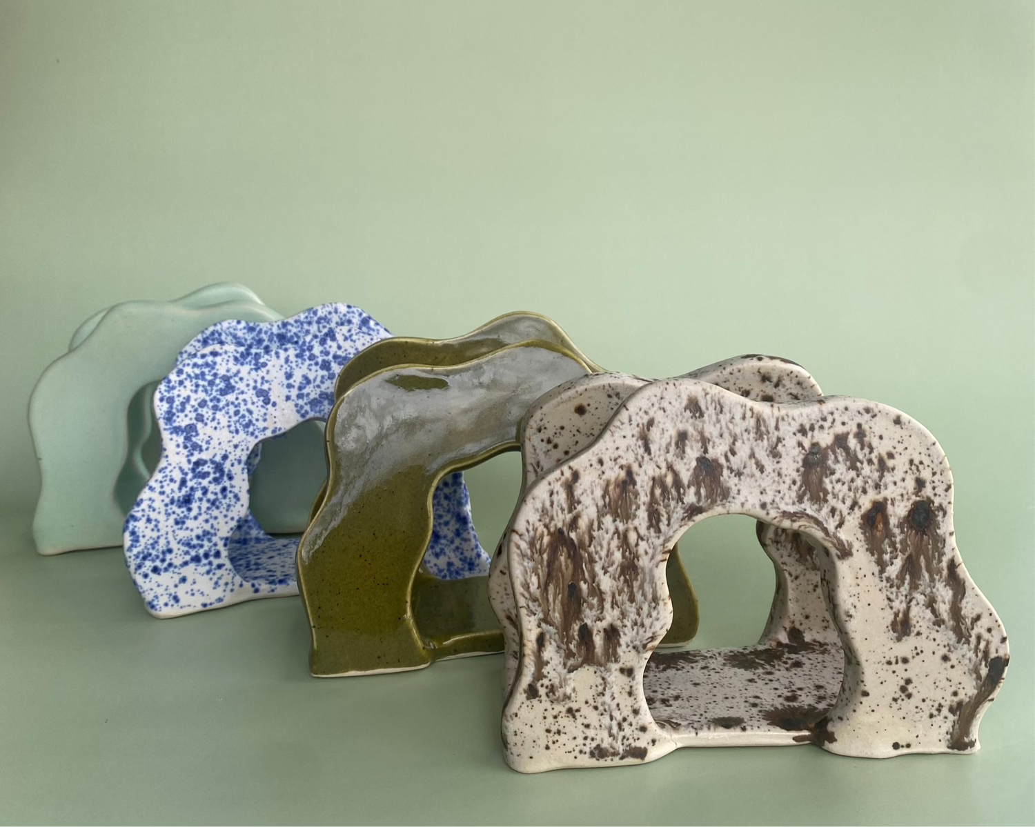 4 Wavy Napkin Holders in a row